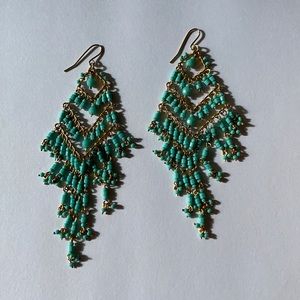 Turquoise and gold colored earrings